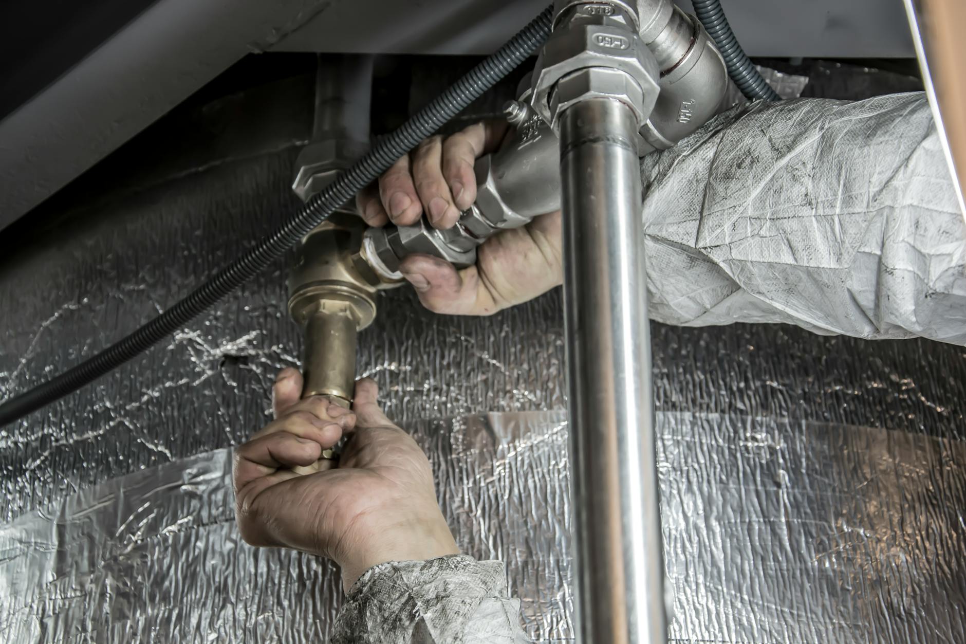 Dick Ray plumber at work in Kansas City